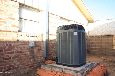 This charming single-level brick home in the highly desirable