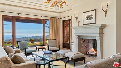 Enter through a grand metal, glass, and wood front door framed - photo 15