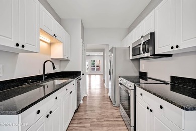 This updated 2-bedroom, 2-bath second-floor condo offers a - photo 18