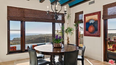Enter through a grand metal, glass, and wood front door framed - photo 19