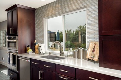 Discover this beautifully remodeled Mediterranean-style home at - photo 12