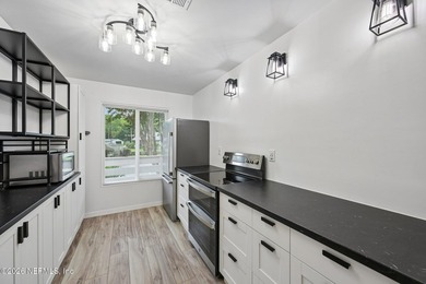 Beautifully updated condo where modern finishes, functional - photo 3