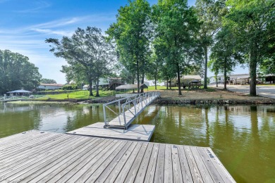 Gorgeous lake side retreat on flat lot with private swim pier - Lake Home For Sale in Cullman, Alabama