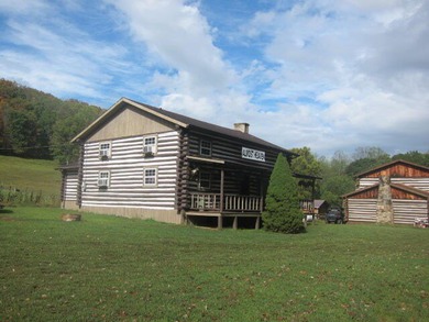 Turnkey, furnished, and unforgettable-this two-story log cabin - photo 2