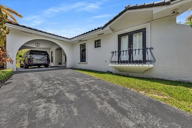 Welcome to a rare lakefront estate in the exclusive, guard-gated - photo 2