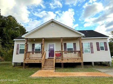 Welcome home to this charming 3-bedroom, 2-bath property located - photo 1