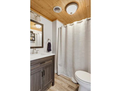 Nestled in the heart of lake living, this charming cottage - photo 20