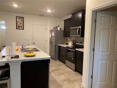 Step into this inviting 3-bedroom, 2-bath home located in the - photo 4