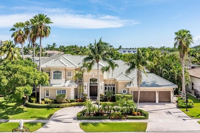 Tucked within the prestigious enclave of Boca Bay Colony, this - photo 2