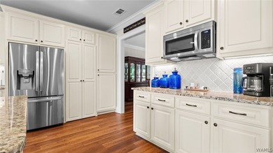 This beautifully crafted 4-bedroom, 3.5-bath brick estate sits - photo 33