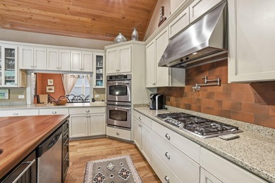 This 3,030-square-foot, 4-bedroom, 4-bathroom lake house with - photo 13