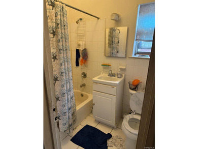 Semi-attached brick 2-family in desirable **Baychester**-a rare - photo 8