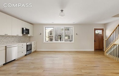 A rare Red Hook townhouse offering two separate residences on - photo 16