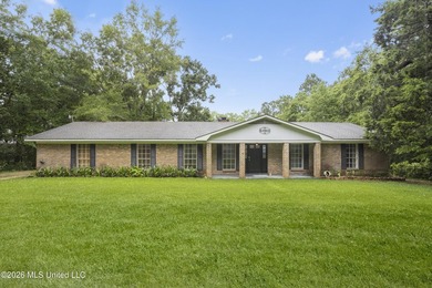 Enjoy waterfront living in this 3-bedroom, 2-bath home located - photo 1