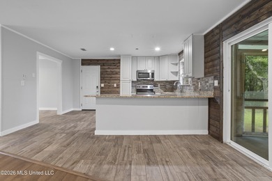 Enjoy waterfront living in this 3-bedroom, 2-bath home located - photo 9