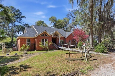 Discover this beautifully designed 4 bedroom, 2 bath brick home - photo 1