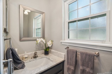 Set on nearly a quarter-acre in a highly sought-after, guarded