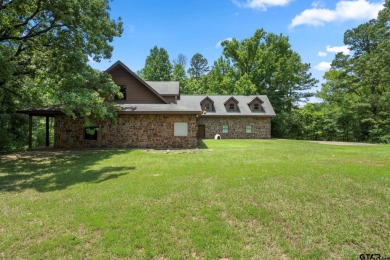 Hidden down a long winding driveway is where you will find this - Lake Home For Sale in Mount Pleasant, Texas