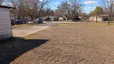 NO HOA! Close to I-30 and the lake. City water and sewer is - photo 3