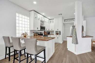 This beautifully updated 4BR/2.5BA waterfront home offers serene - photo 1