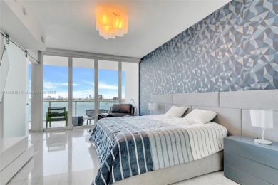 SPECTACULAR UNIT WITH DIRECT BAY VIEWS OF BISCAYNE BAY. 2 BED, 2
