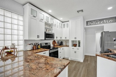 This beautifully updated 4BR/2.5BA waterfront home offers serene - photo 5