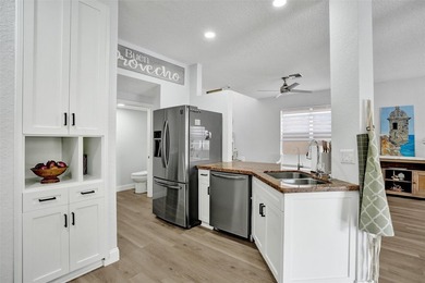 This beautifully updated 4BR/2.5BA waterfront home offers serene - photo 6