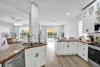 This beautifully updated 4BR/2.5BA waterfront home offers serene - photo 7