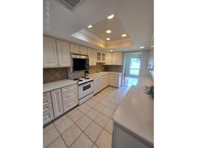 This 2-bedroom, 2-bath single-level condo is located within the - photo 1