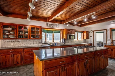 Timeless waterfront retreat with soaring cathedral ceilings, an - photo 12