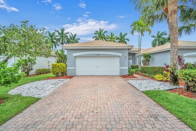 Welcome home to this beautifully updated villa in the highly - photo 1
