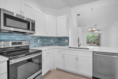 Welcome home to this beautifully updated villa in the highly - photo 4