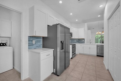 Welcome home to this beautifully updated villa in the highly - photo 6
