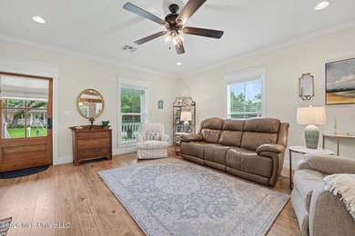 Nestled amongst majestic Live Oaks on one of Waveland's most - photo 3