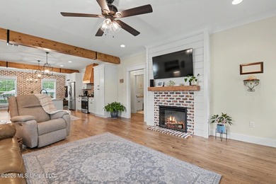Nestled amongst majestic Live Oaks on one of Waveland's most - photo 6