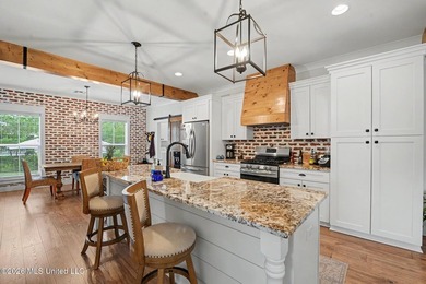 Nestled amongst majestic Live Oaks on one of Waveland's most - photo 8