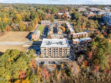 Lakeside living. First level condo conveniently situated on NCSU