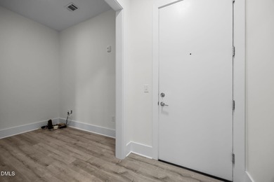 Lakeside living. First level condo conveniently situated on NCSU