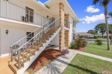 Beautiful second floor end unit located in the guard gated High - photo 1