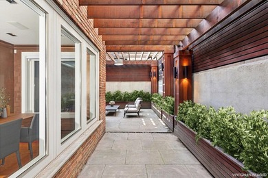 This exceptional over 20-foot-wide townhouse is discreetly - photo 12