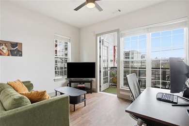 Bright, open double corner unit located just one block from the