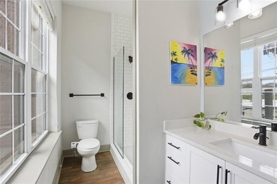 Bright, open double corner unit located just one block from the