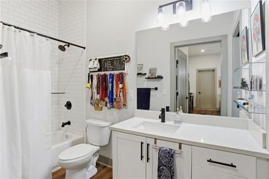 Bright, open double corner unit located just one block from the