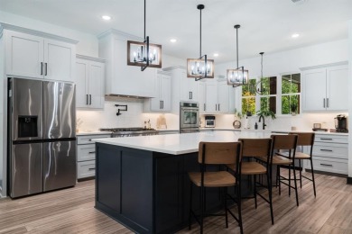 Discover this custom built modern farmhouse set on 4.65 acres