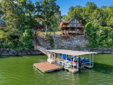 This lakeside retreat features a main home + guest house with - Lake Home For Sale in Cullman, Alabama