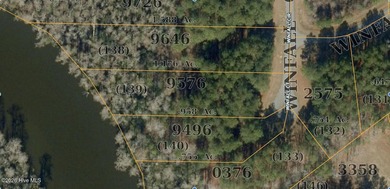 Set within the gated RiverSound community, this waterfront lot - photo 3