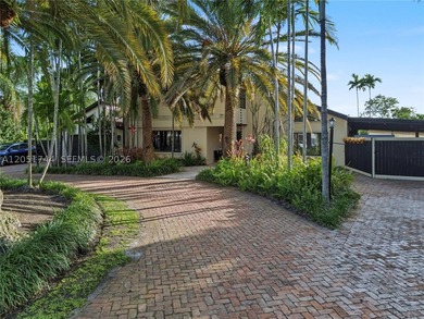 Tucked behind a private, palm-lined entrance in sought-after - photo 1