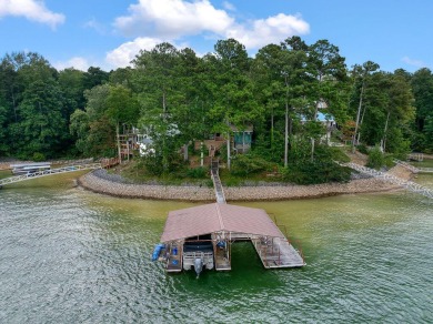 Tucked along 140 feet of deep, year-round shoreline on beautiful - Lake Home For Sale in Crane Hill, Alabama