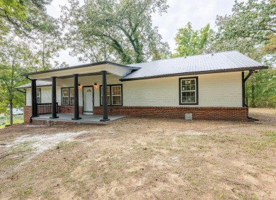 a beautifully updated 4-bedroom, 2-bath Smith Lake home sitting - Lake Home For Sale in Jasper, Alabama