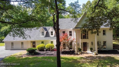 Nestled on a stunning 3.7-acre treed lot complete with a private - photo 1